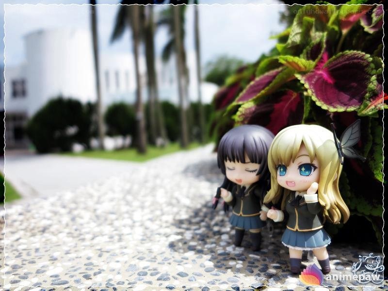 Anime figures on a garden path