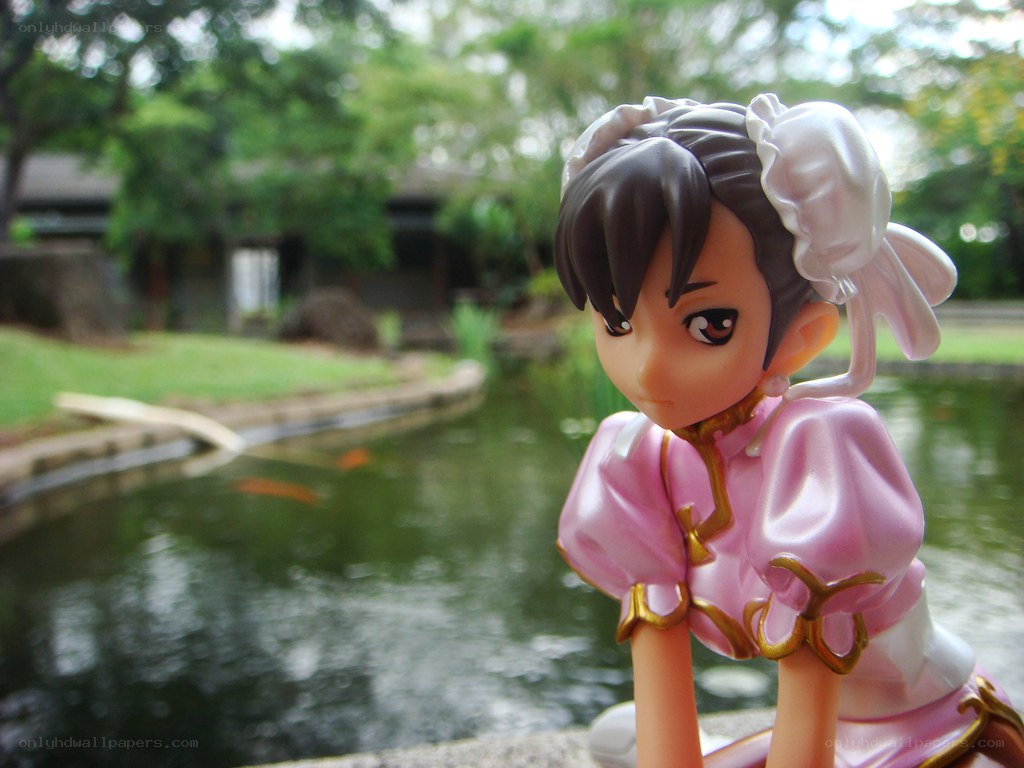 anime figurine by a pond