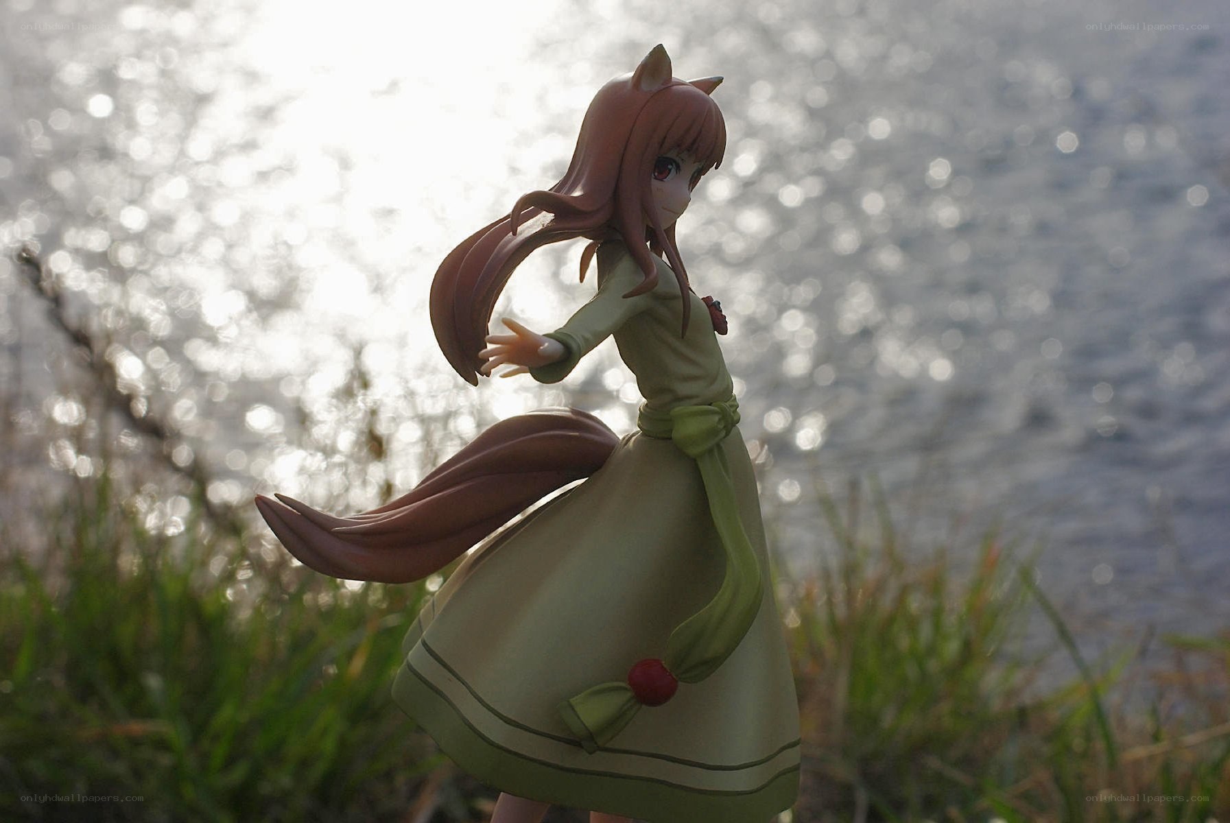 anime figurine by water