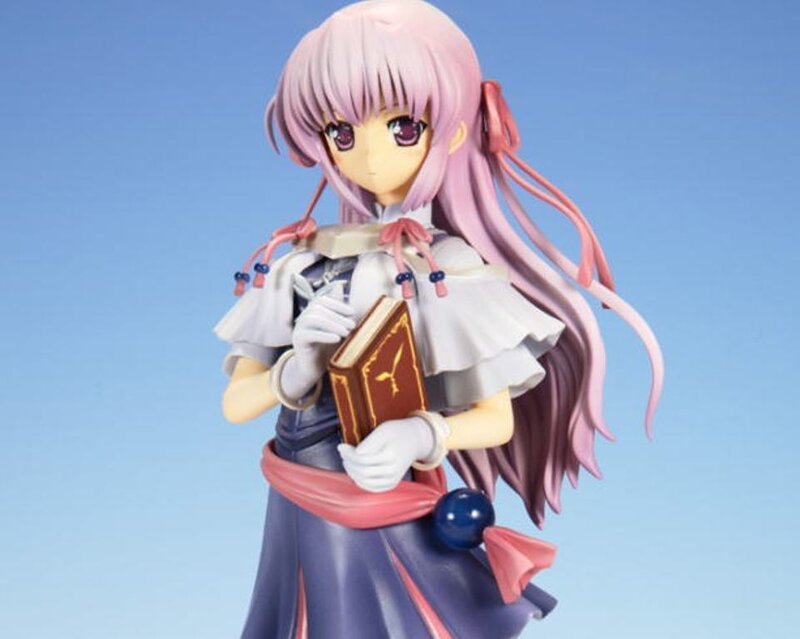 Anime Figurine Holding Book