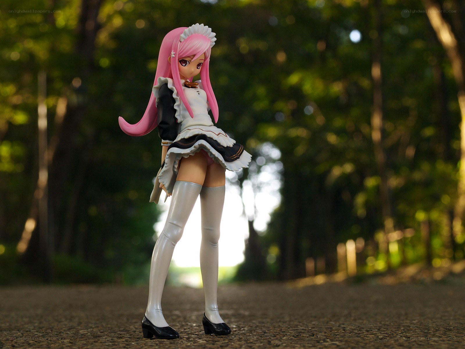anime figurine in forest
