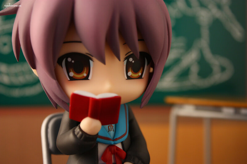 anime figurine reading book