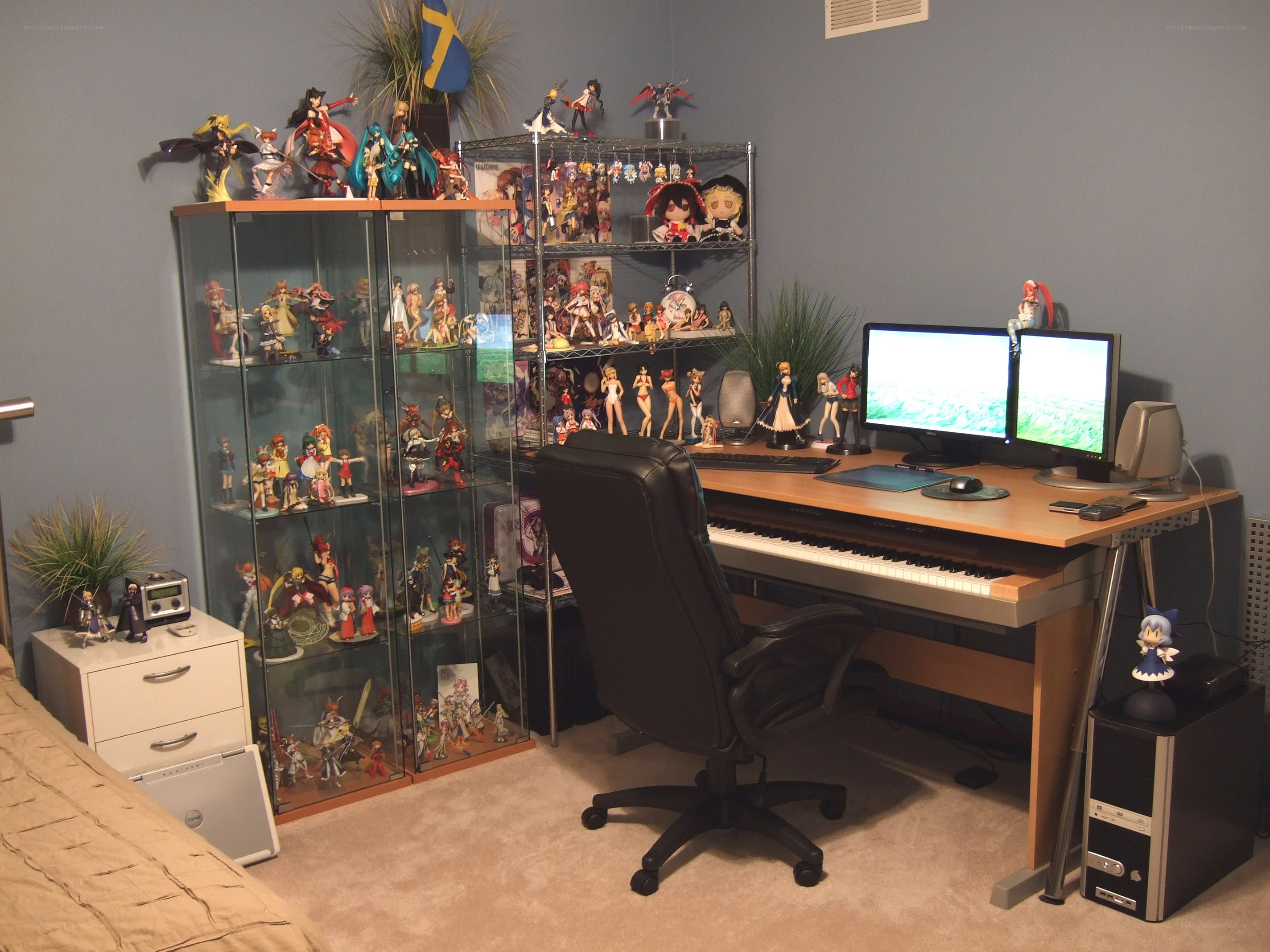 anime figurines and computer desk