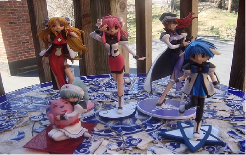 Anime figurines on a tiled table