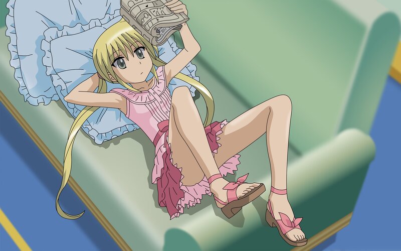 Anime girl reading on a couch