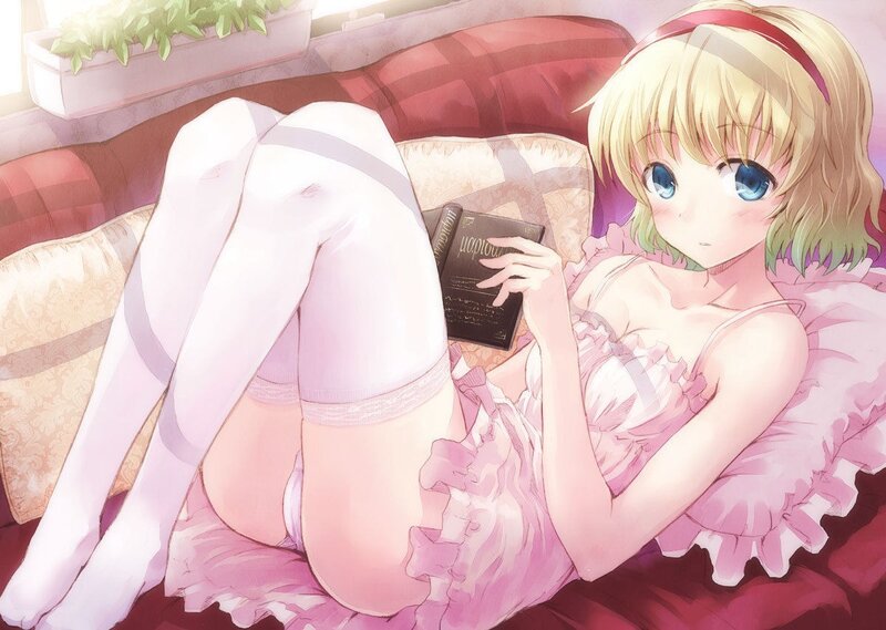 Anime girl reading on a couch