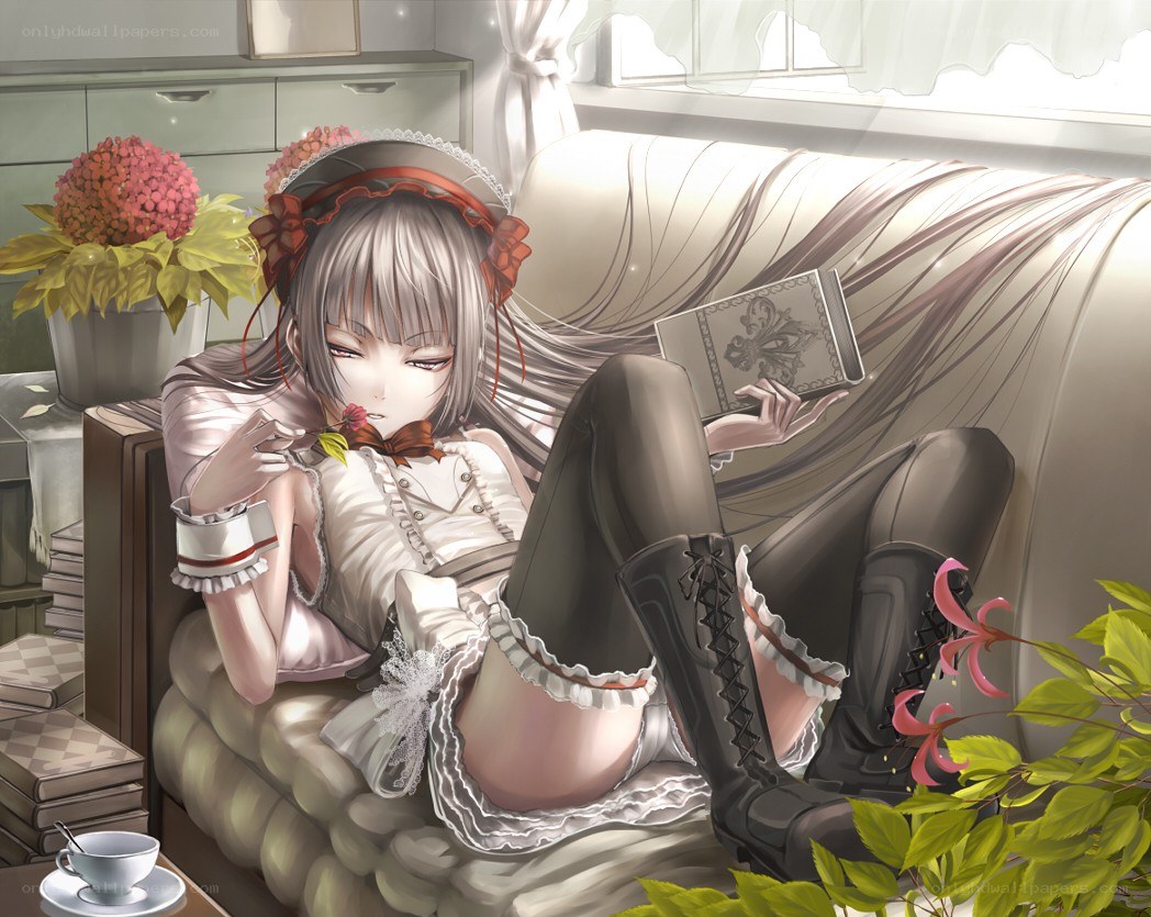 Anime girl reading on a sofa