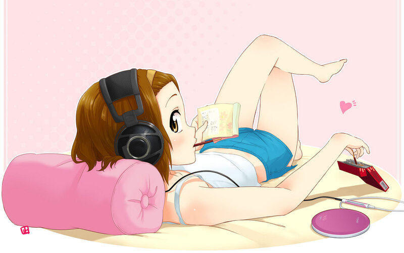 Anime girl reading with headphones