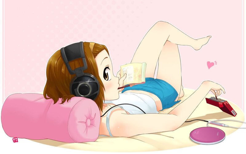 Anime girl reading with headphones