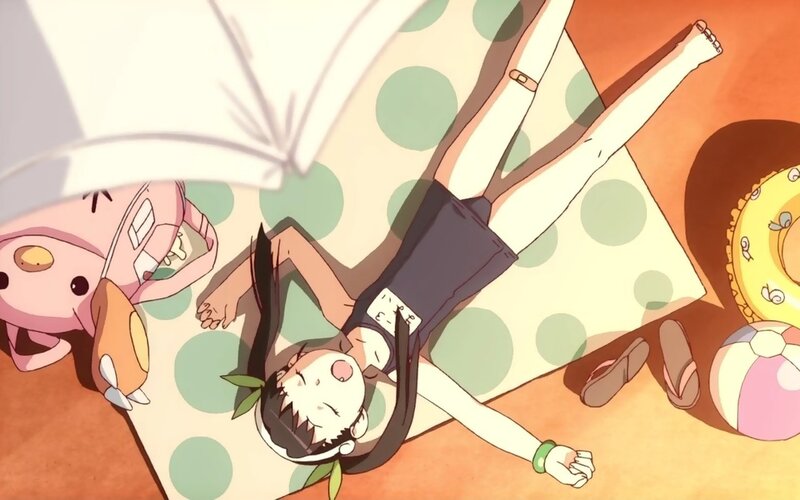 Anime girl relaxing on a towel