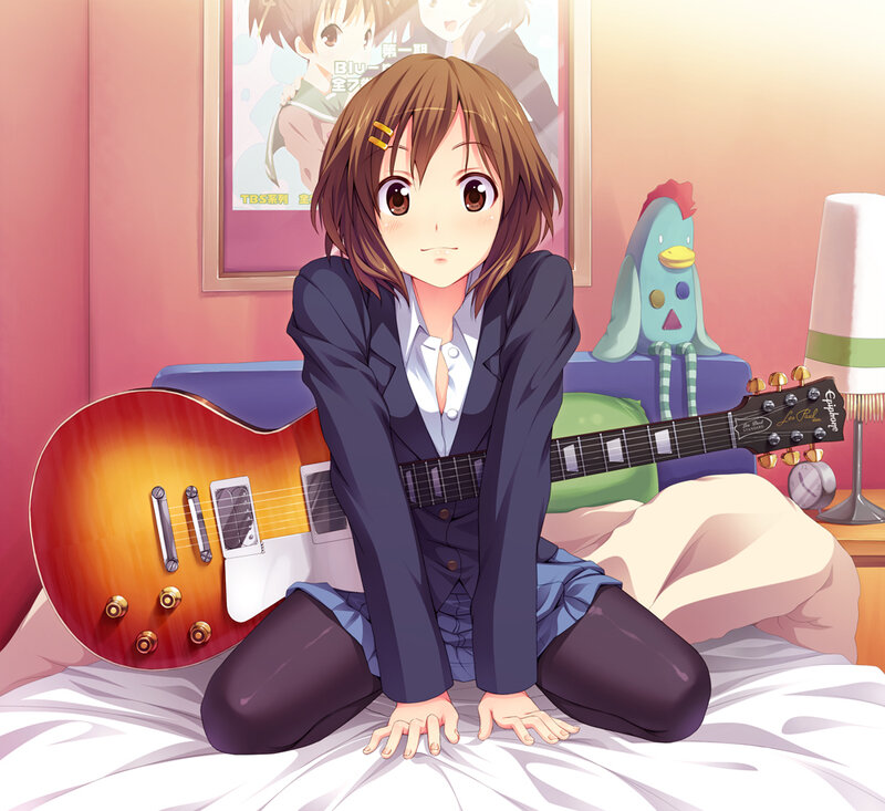 Anime girl with guitar on bed
