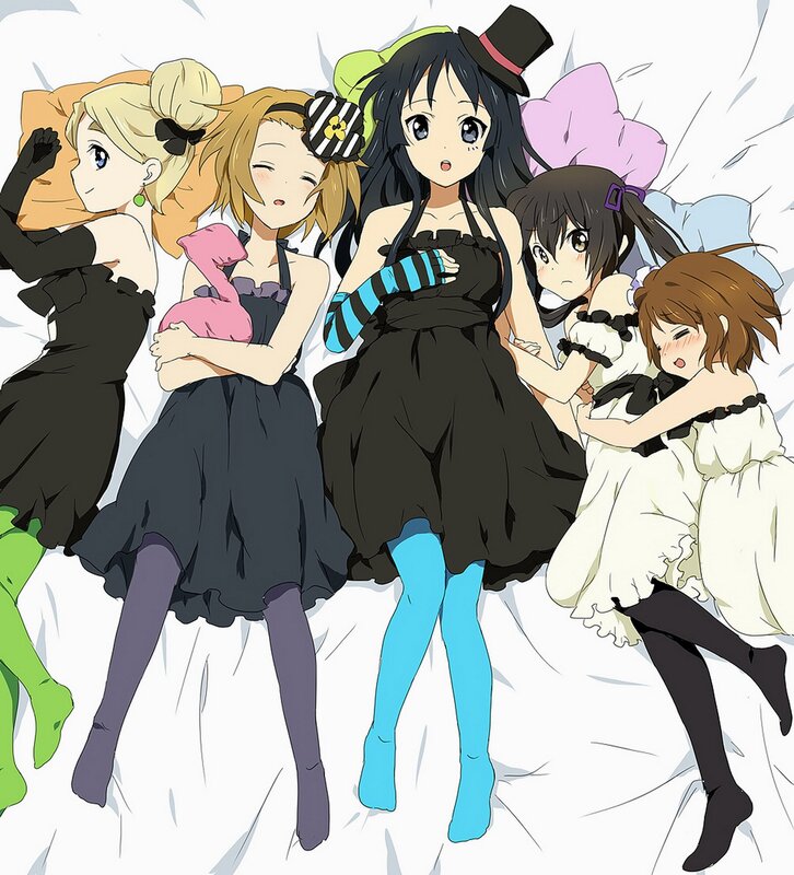anime girls in dresses on a bed