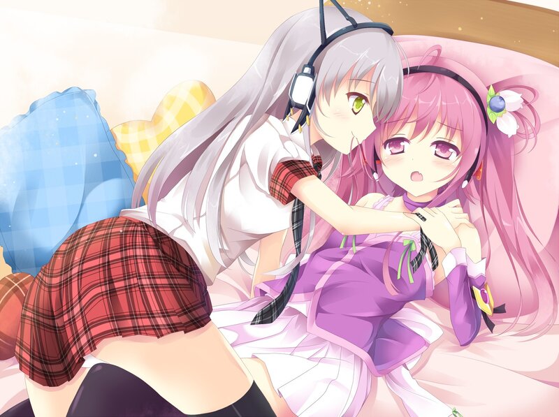 Anime girls on a bed