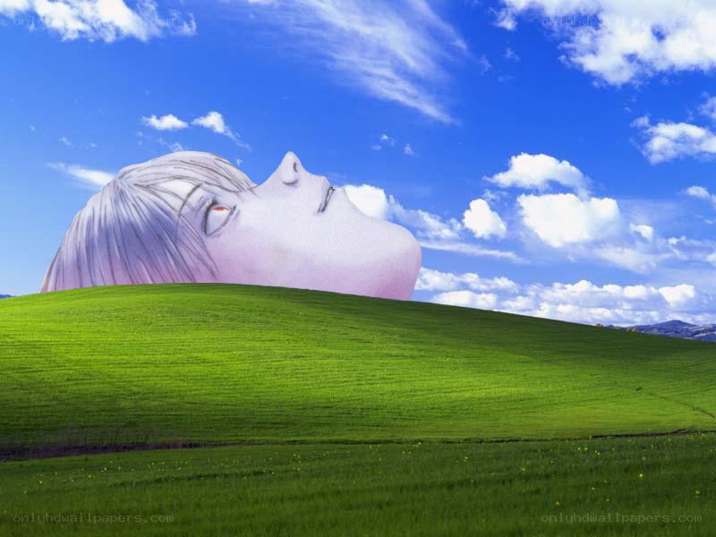 Anime head on a green hill