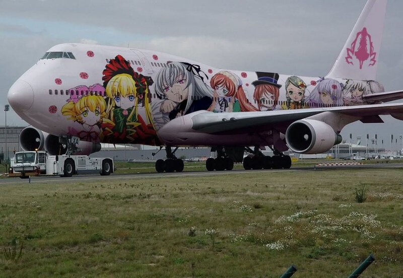 anime-themed airplane on tarmac