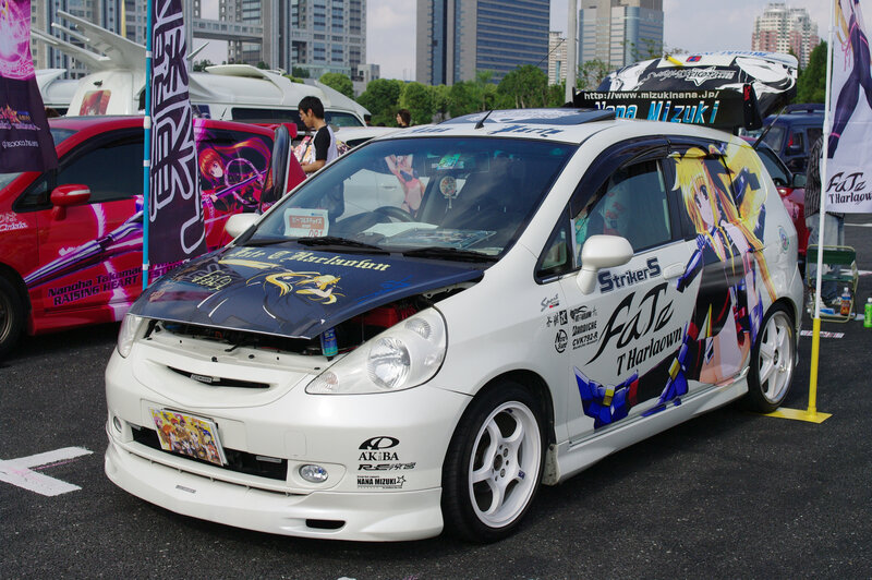 Anime-themed car at a show