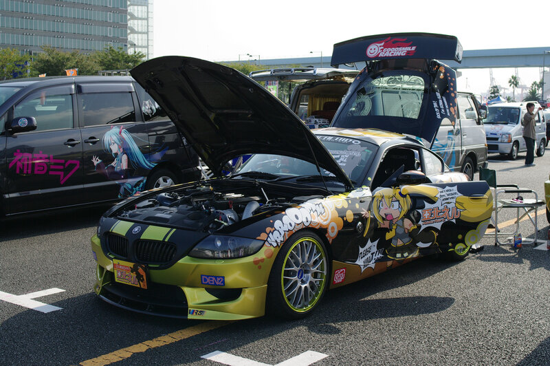 Anime-themed car at a show