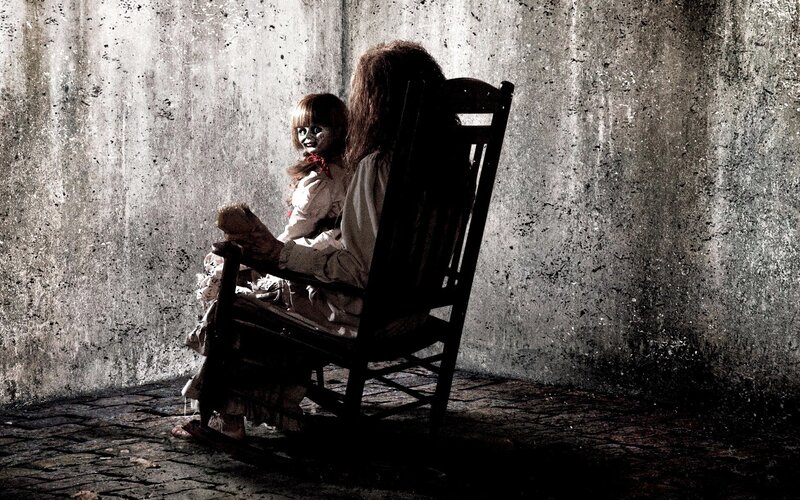 Annabelle doll in a rocking chair