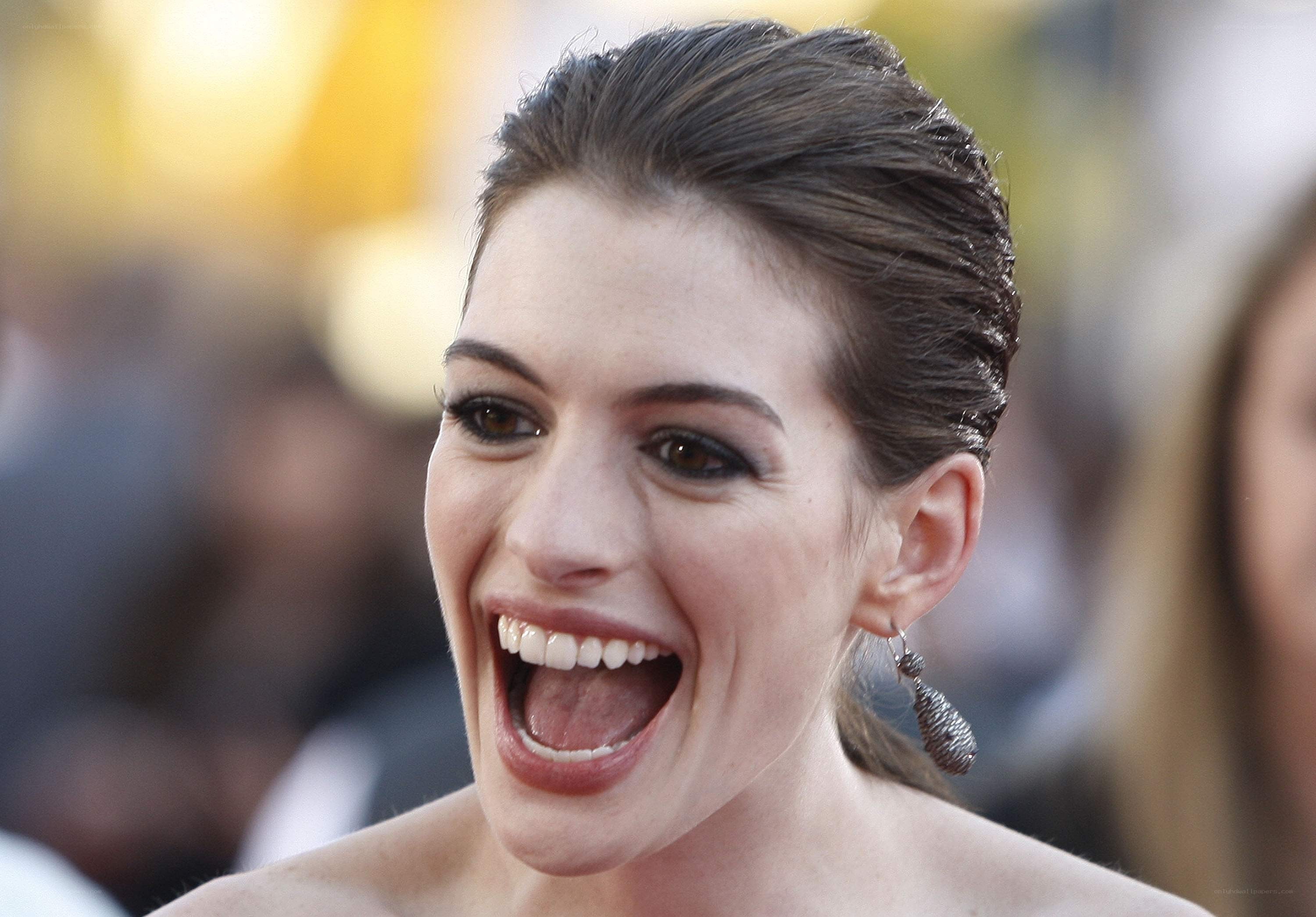 Anne Hathaway laughing