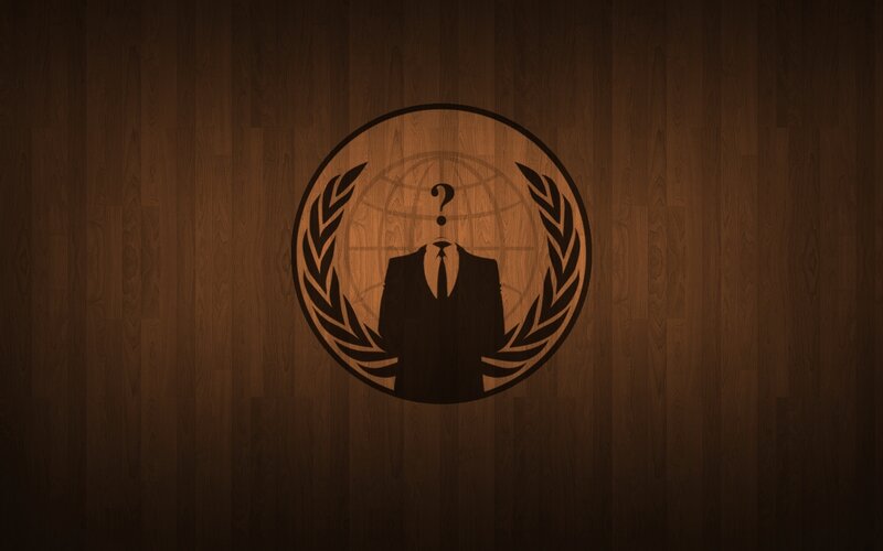 Anonymous logo on wood