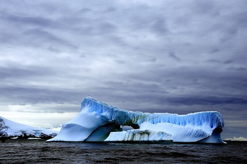 Antarctic iceberg with arch