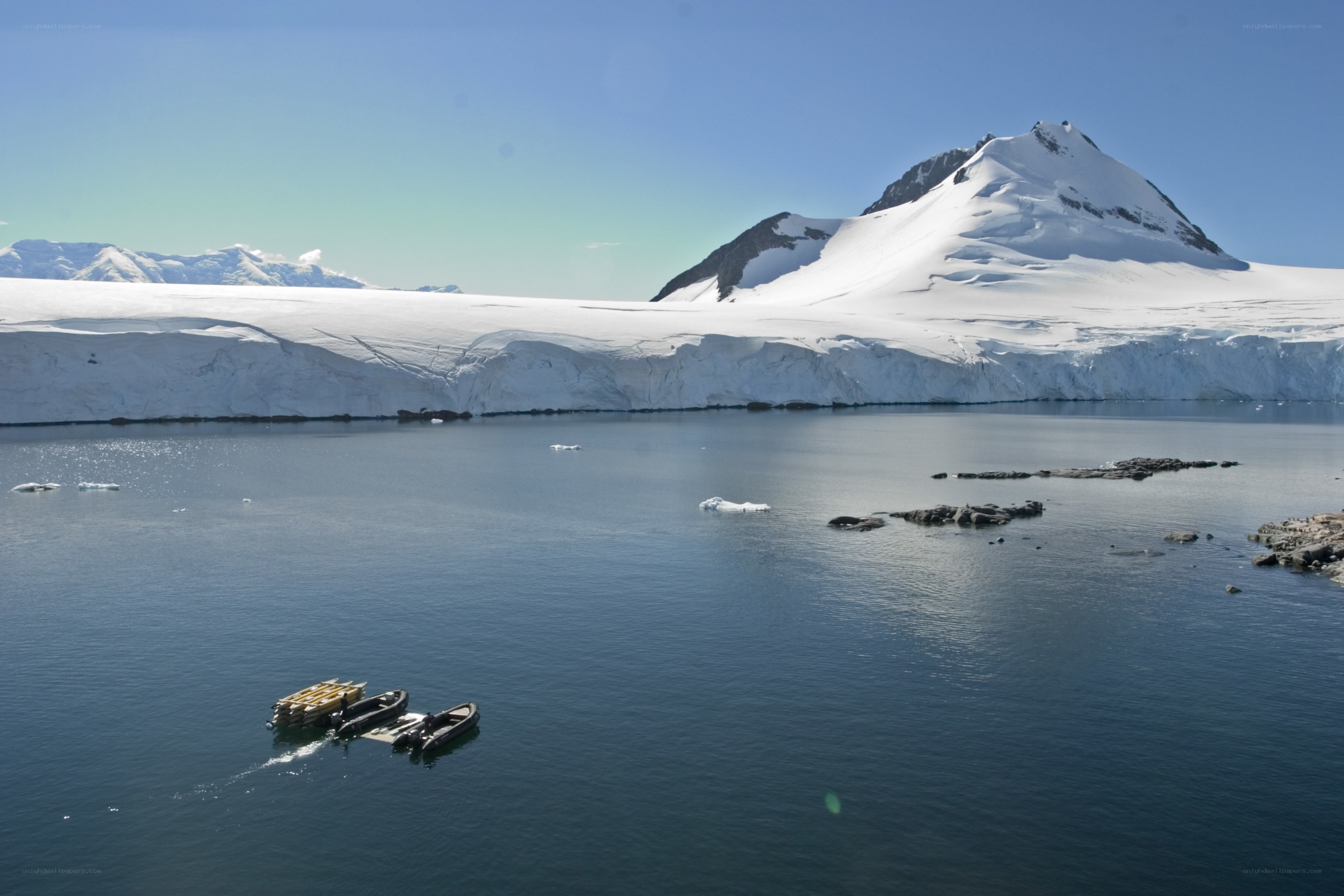 Antarctic icebergs and boats