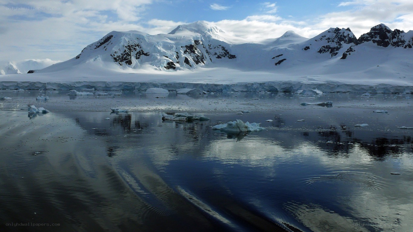 Antarctic icebergs and mountains
