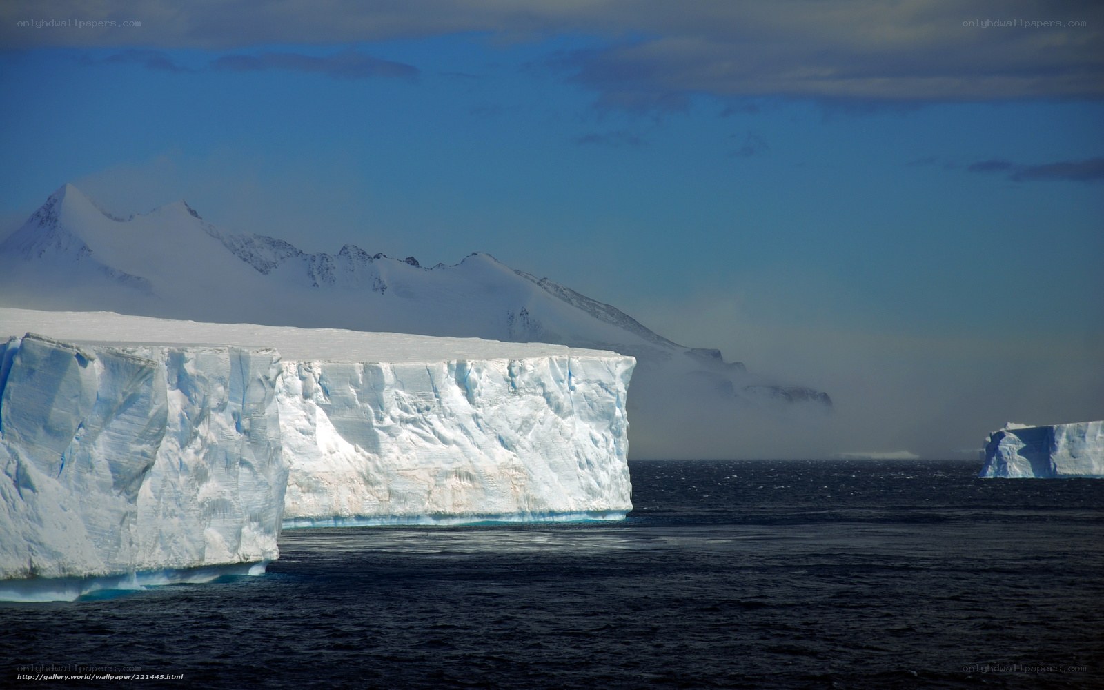 Antarctic icebergs and mountains