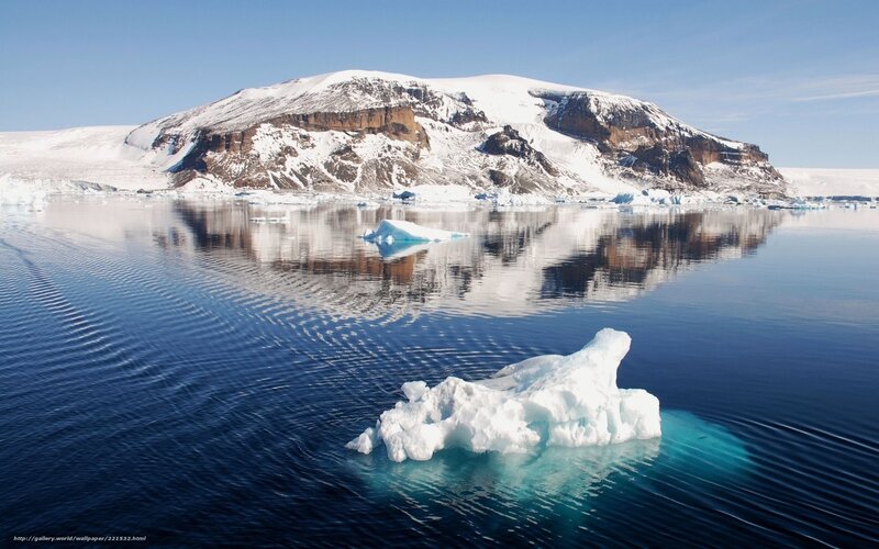 Antarctic icebergs and mountains