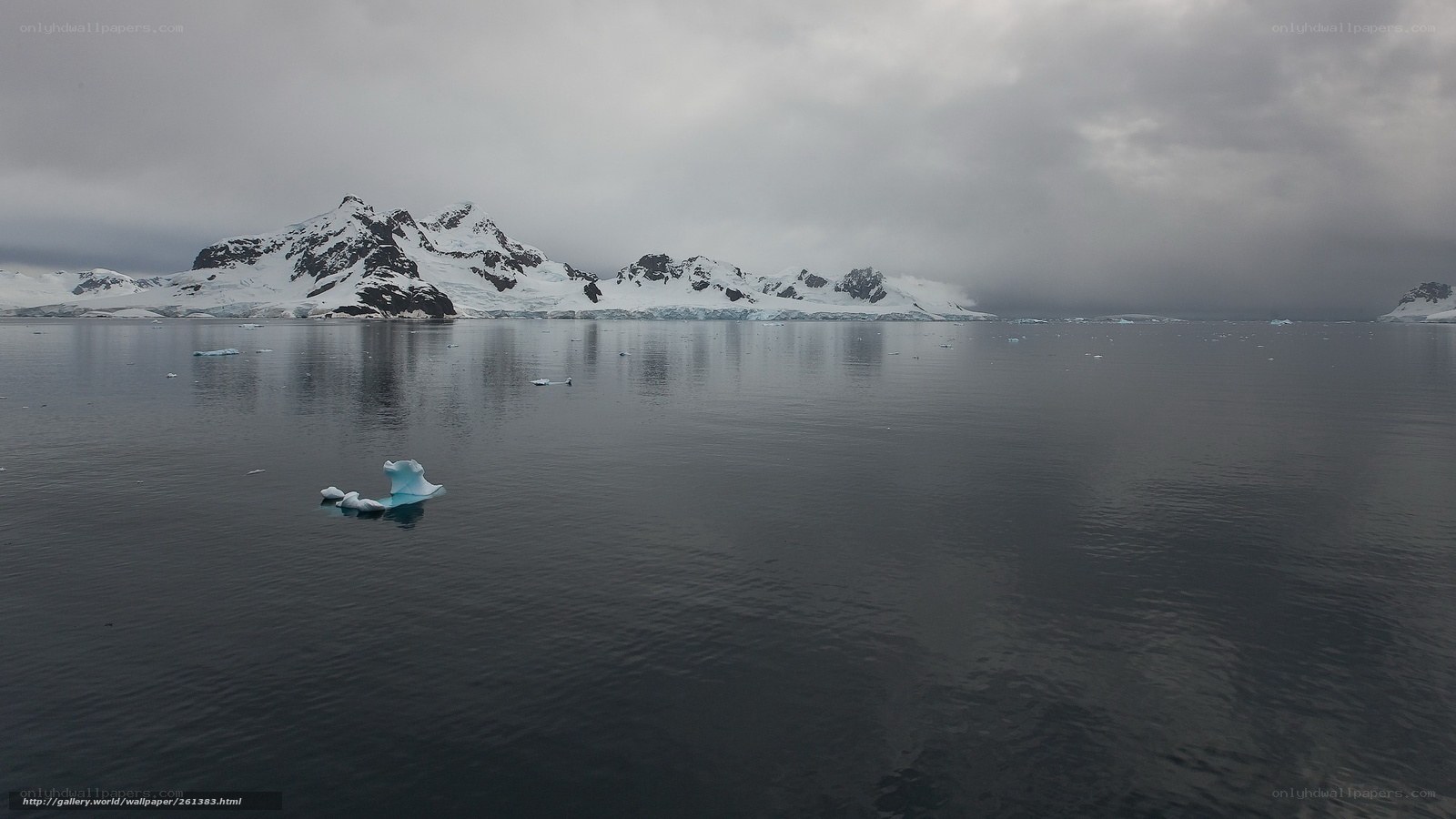 Antarctic icebergs and mountains