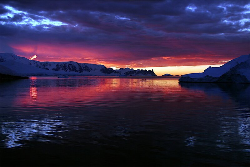 Antarctic sunset over icy waters