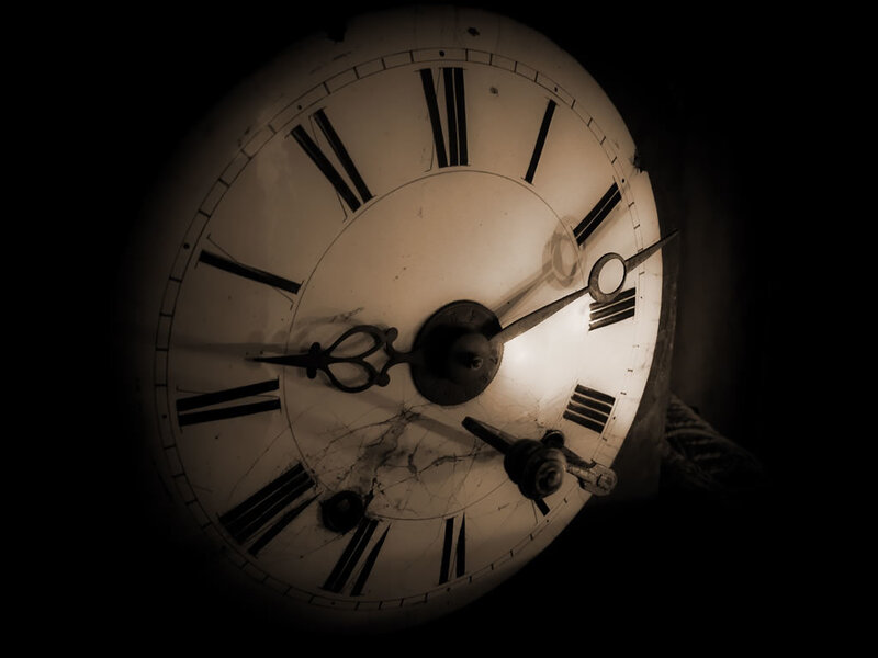 antique clock face in dim light