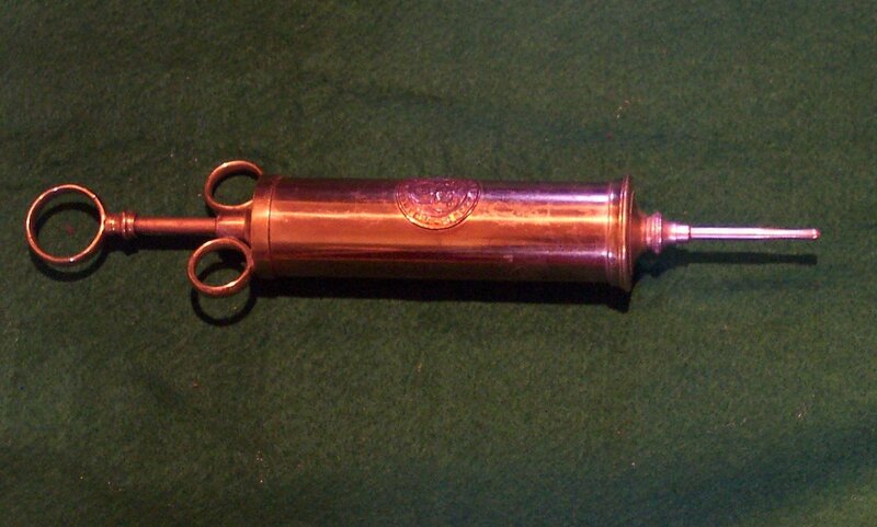 Antique copper syringe