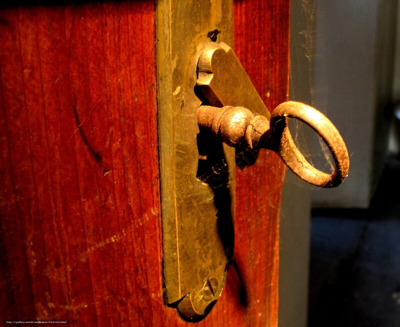 antique key in wooden door