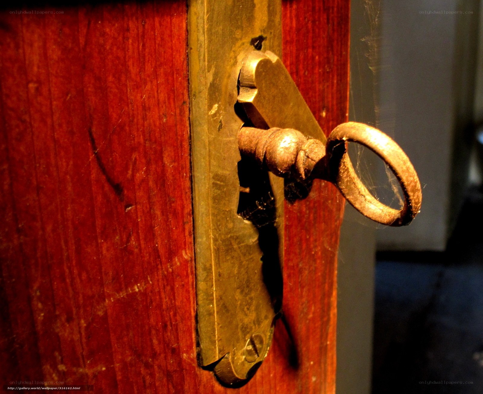 antique key in wooden door