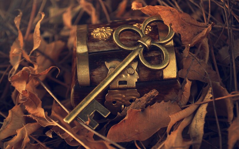 antique key on wooden box