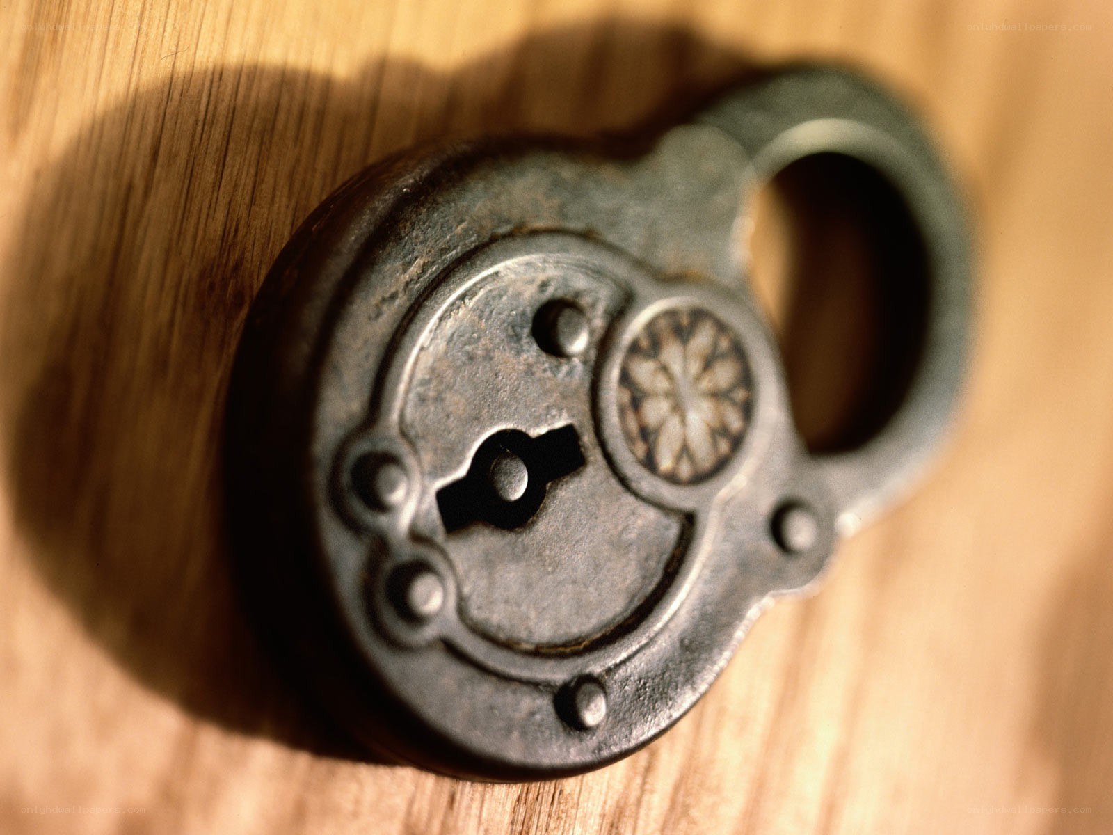 antique padlock on wood