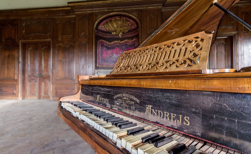 Antique Piano in Room