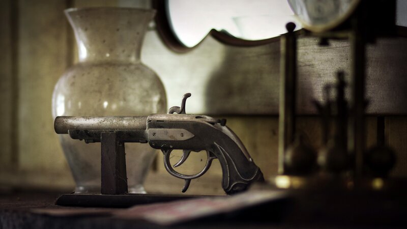 Antique Pistol on Stand
