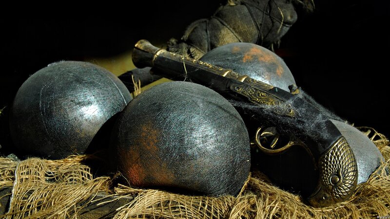 antique pistol with cannonballs