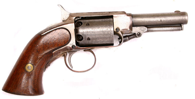 antique revolver with wooden grip