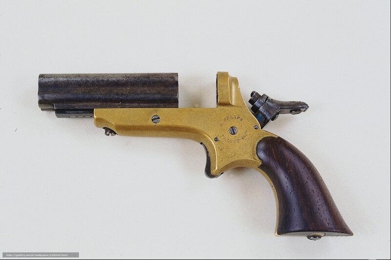 antique revolver with wooden grip