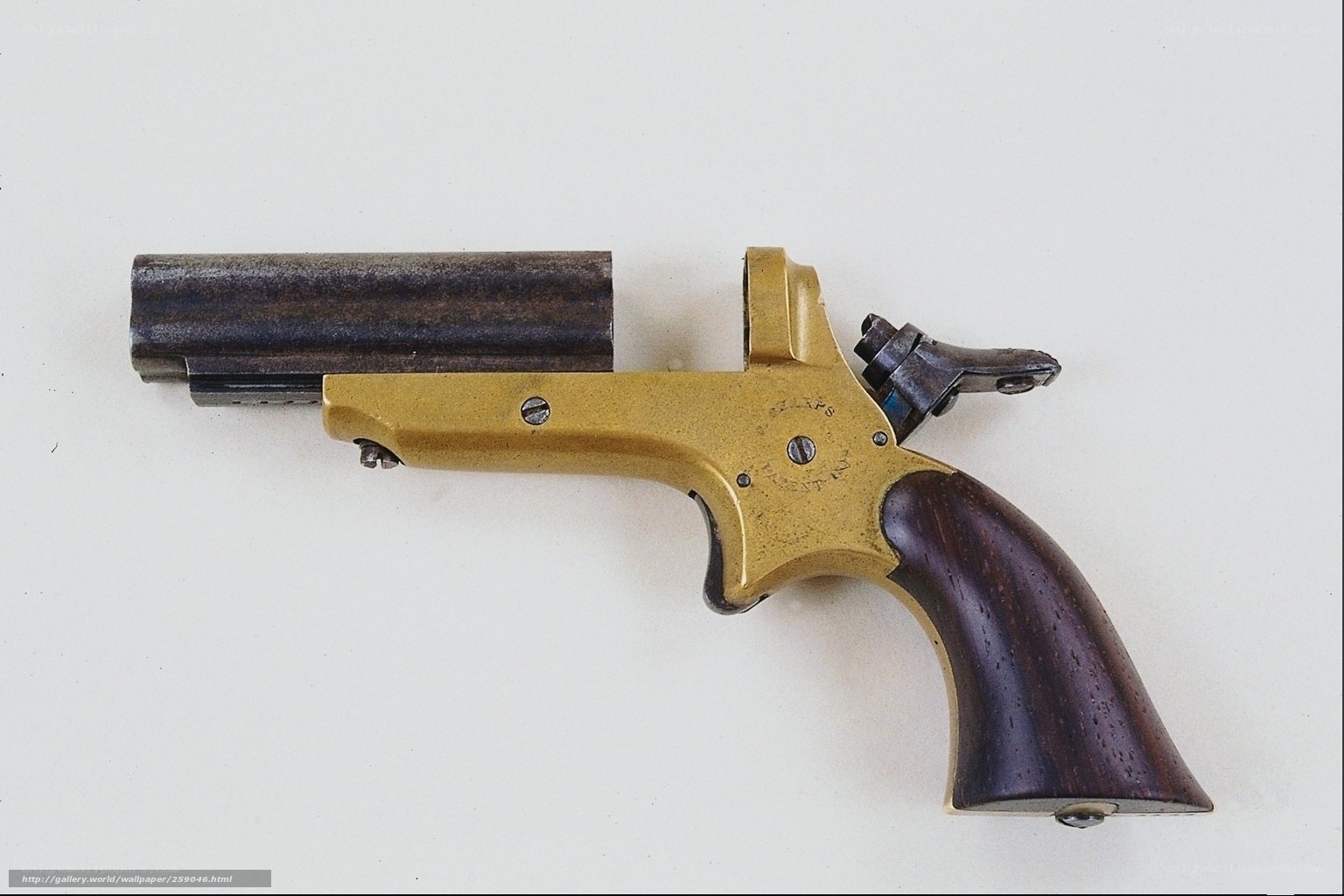 antique revolver with wooden grip