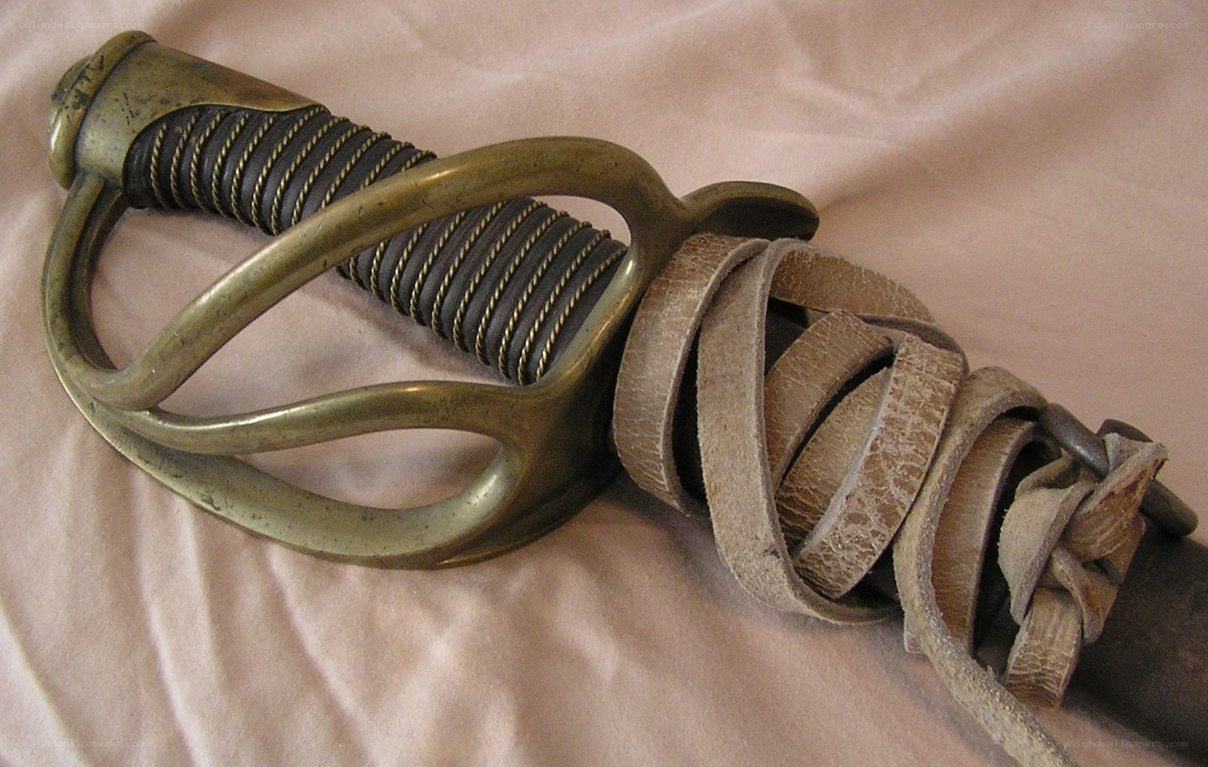 antique sword with leather wrap
