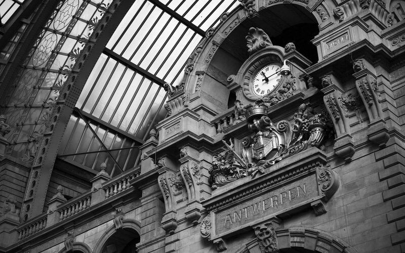 Antwerp Train Station Clock — Black, Dramatic, Photograph, Ornate Architecture