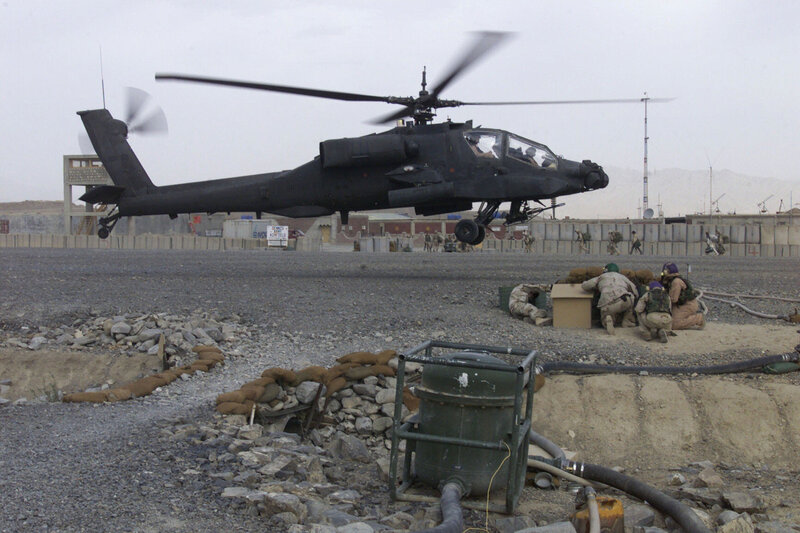 Apache helicopter landing at base