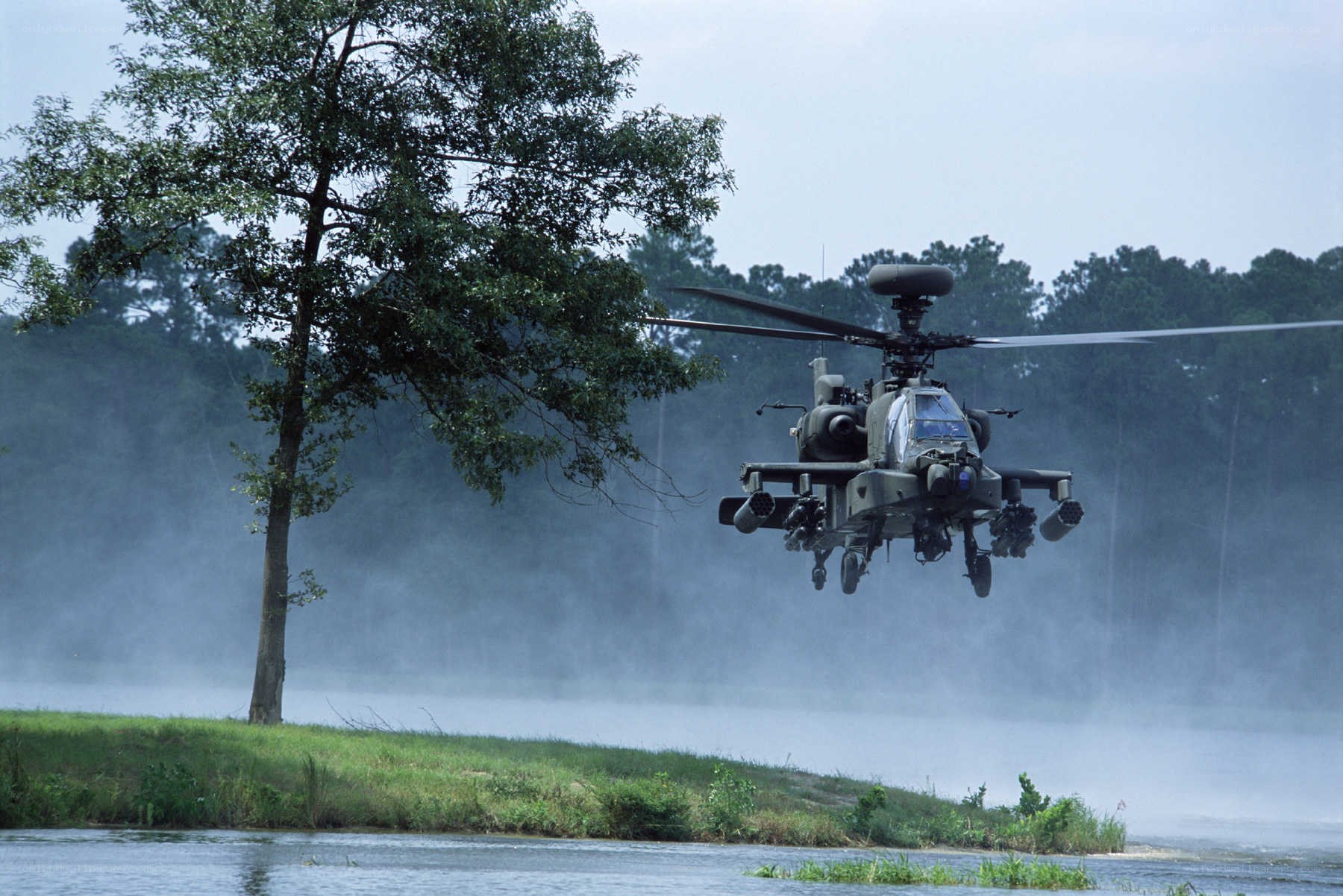 Apache helicopter over water