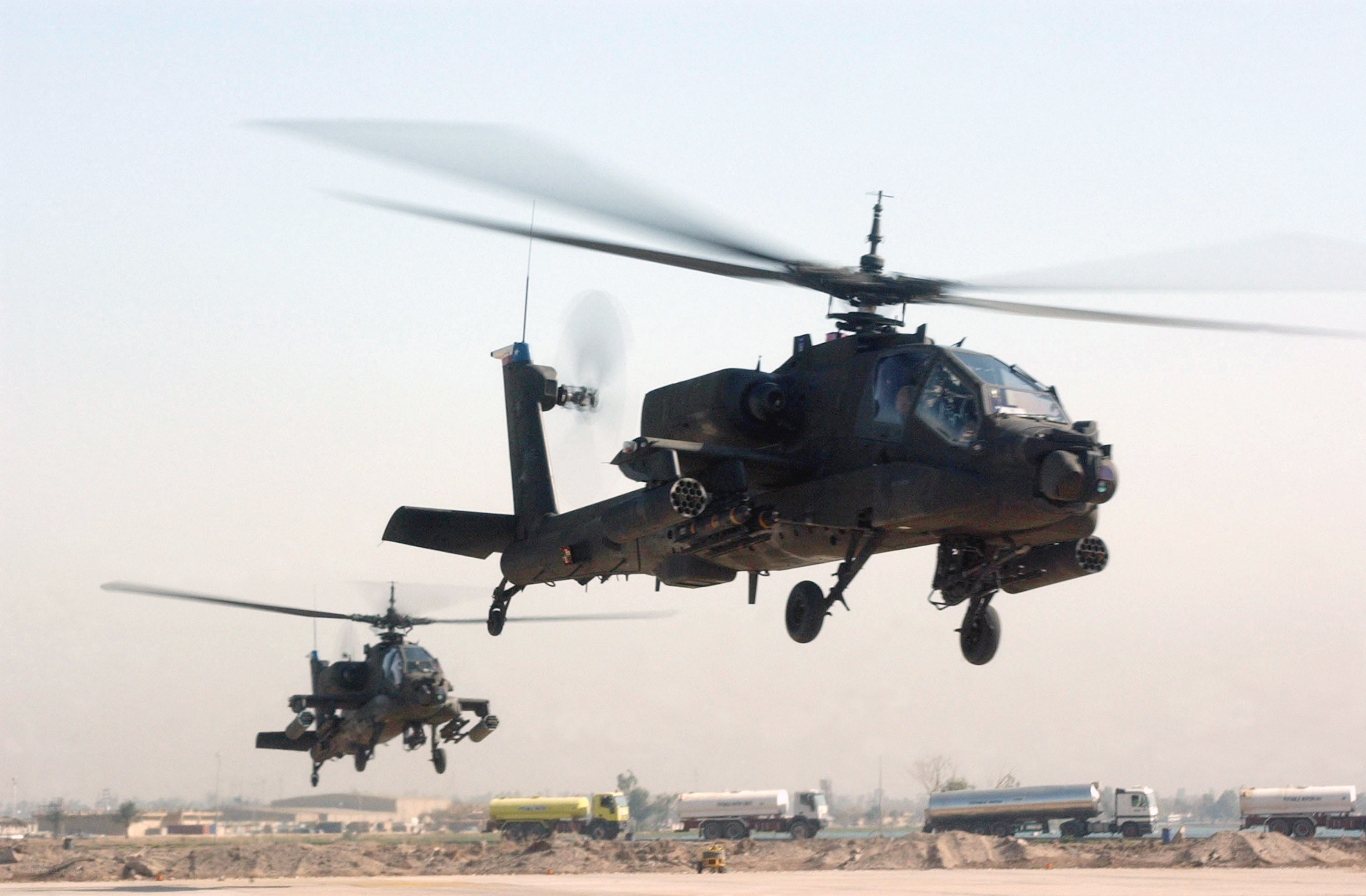Apache helicopters in flight
