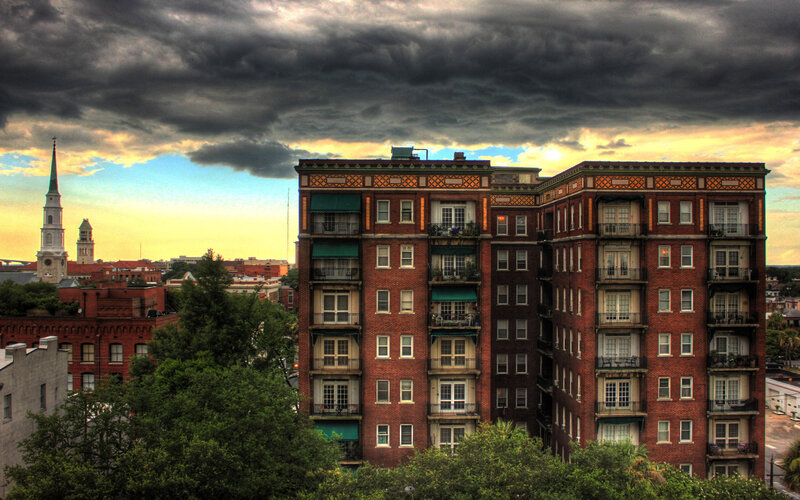 apartment building under stormy sky