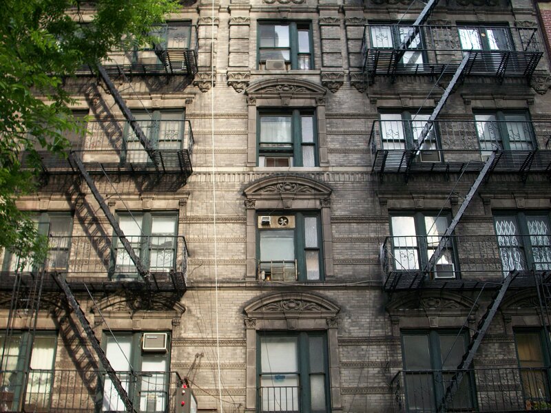 apartment building with fire escapes